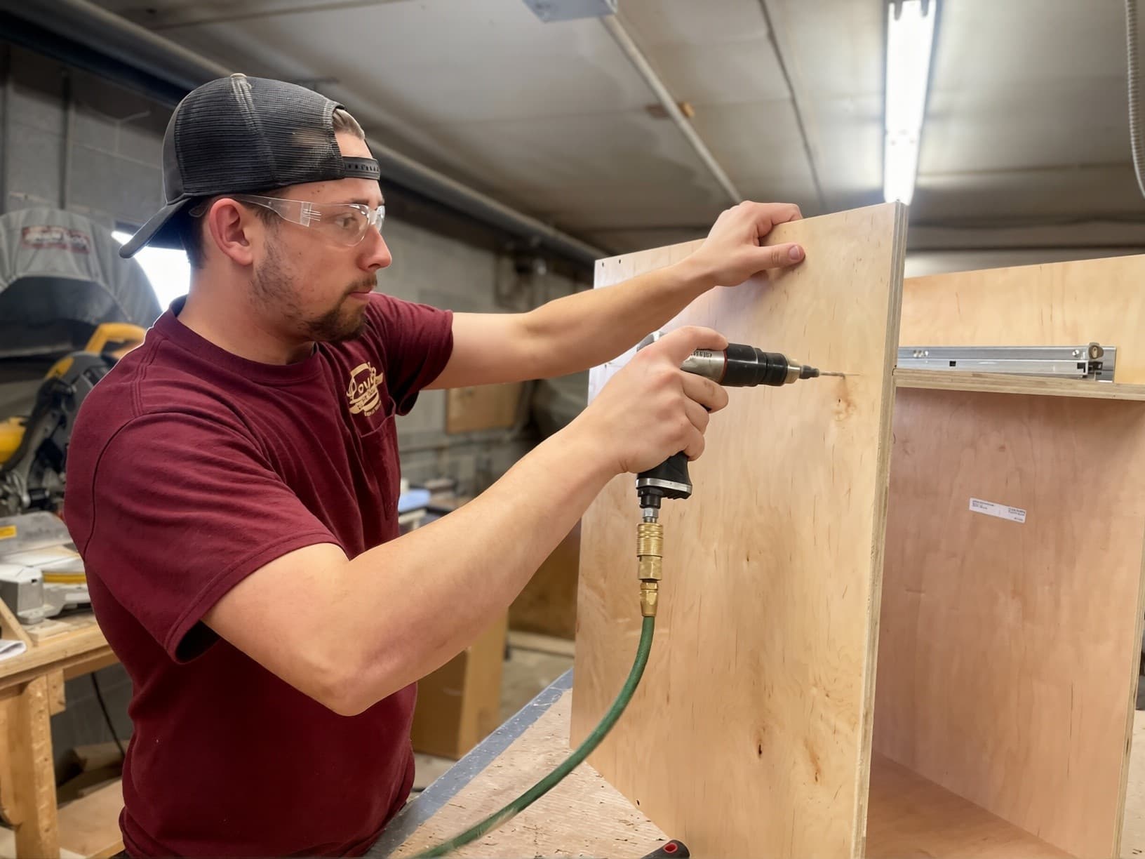 Lloyd’s Cabinet Shop founder, Lloyd, working on a cabinet project in the shop